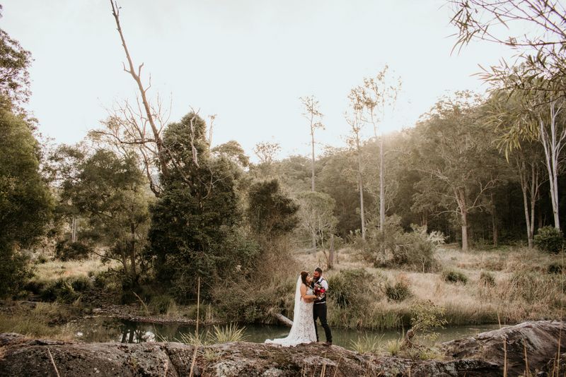 Couple standing in forest