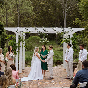 gold coast couple gets married in front of white gazebo overlooking the hinterland