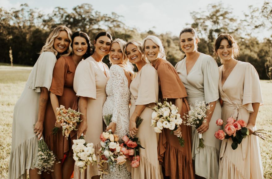 The bridal party wore neutral and earthy shades of silk, perfect for a farm wedding