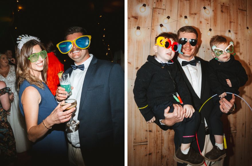 Wedding guests dress up in fun glasses and accessories at the reception 