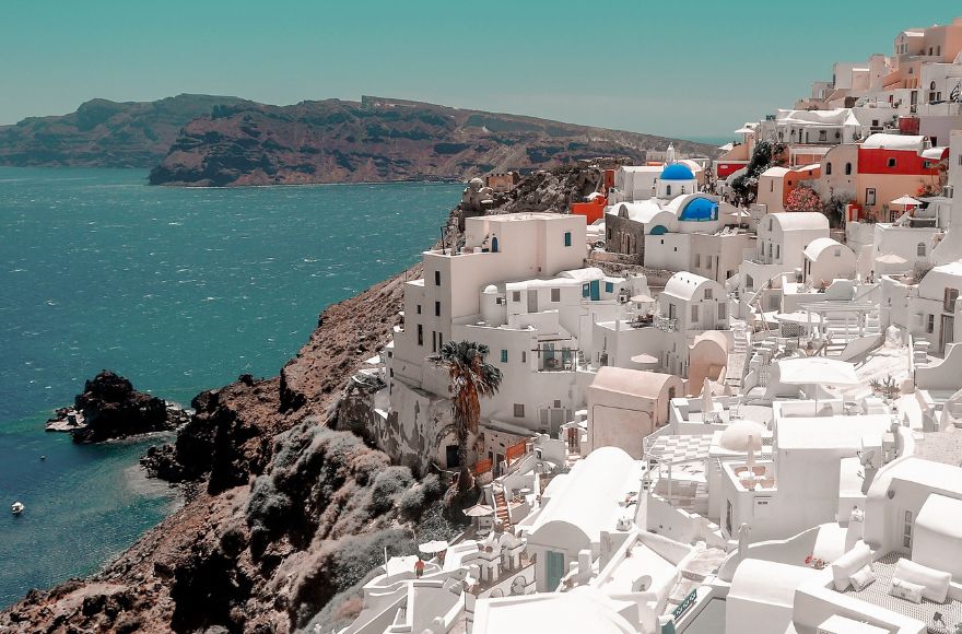 White buildings lining the coastline in Greece